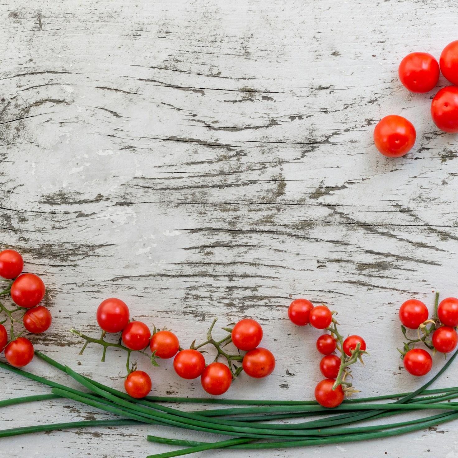 Diverse group of community members sharing a meal together, showcasing the social bonds formed through collaborative cooking